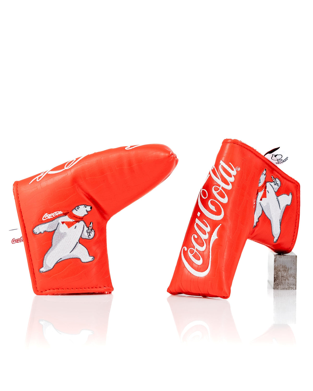 Bright red Coca-Cola blade putter cover featuring a polar bear design, perfect for golfers wanting a fun, standout accessory.