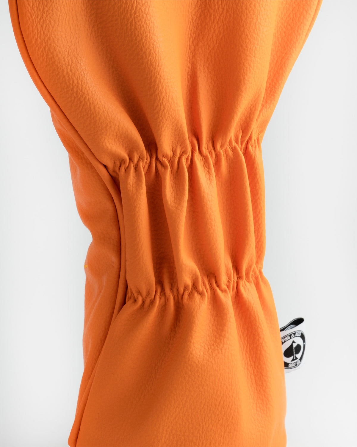 Kenny McCormick driver cover featuring South Park character design, in bright orange and yellow colors, with intricate details and embroidered elements.
