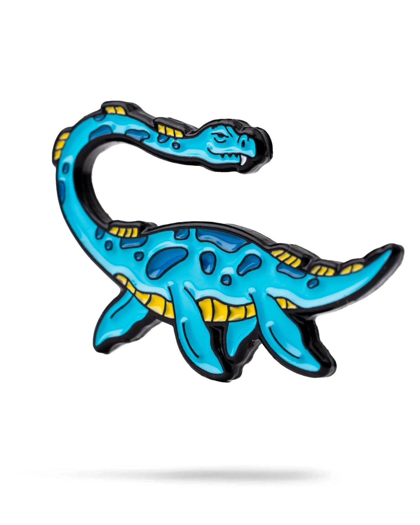 Colorful Nessie ball marker featuring a playful blue dinosaur design, perfect for adding personality to your golf game.