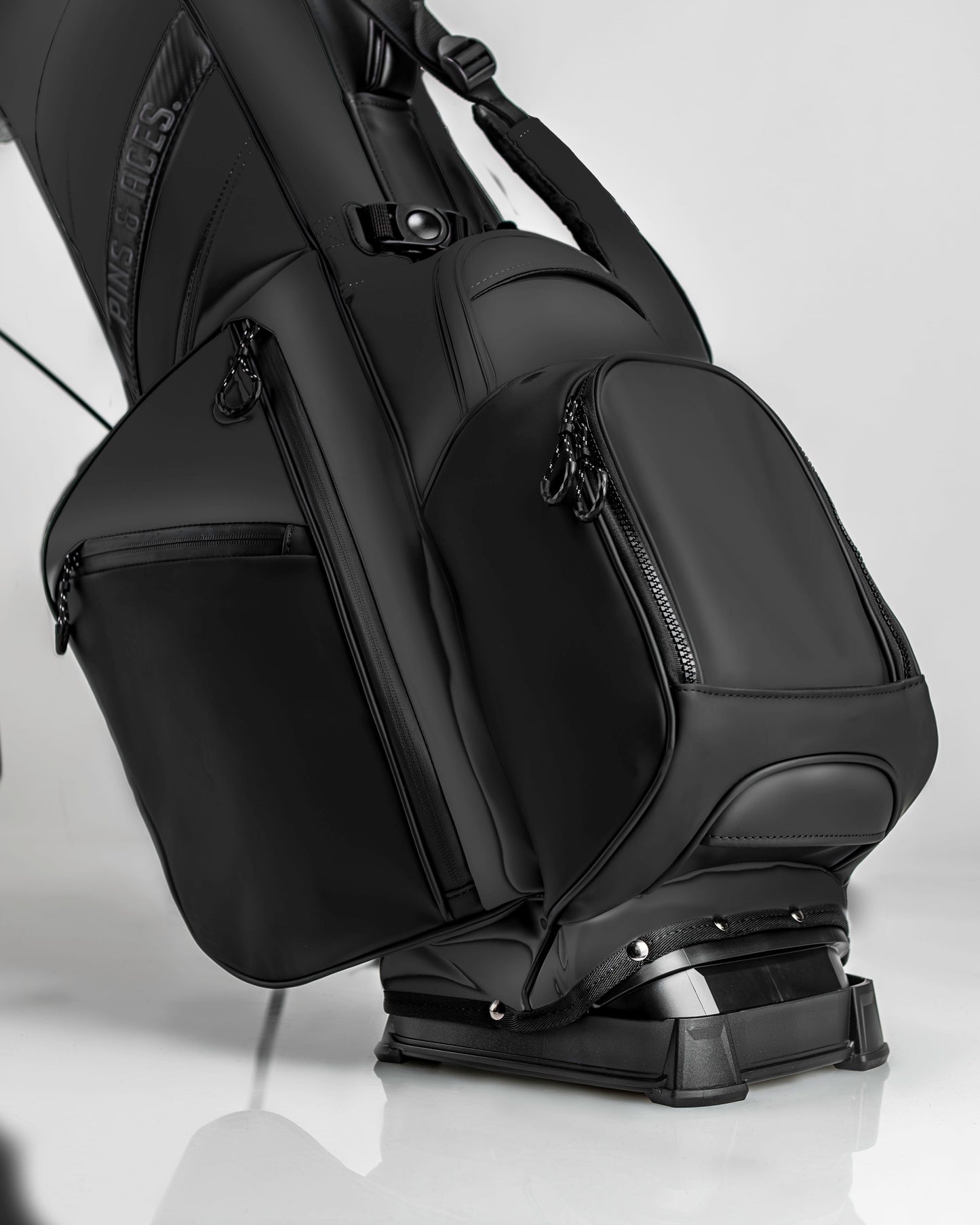 Sleek Player Preferred Golf Bag in Obsidian with multiple zippered pockets and a sturdy base for stability on the course.
