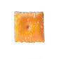 Cheese Cracker Ball Marker featuring a whimsical cheese design, ideal for golf enthusiasts.
