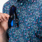 Fluorescent floral print dress on a model, showcasing vibrant colors and a spring-inspired design.