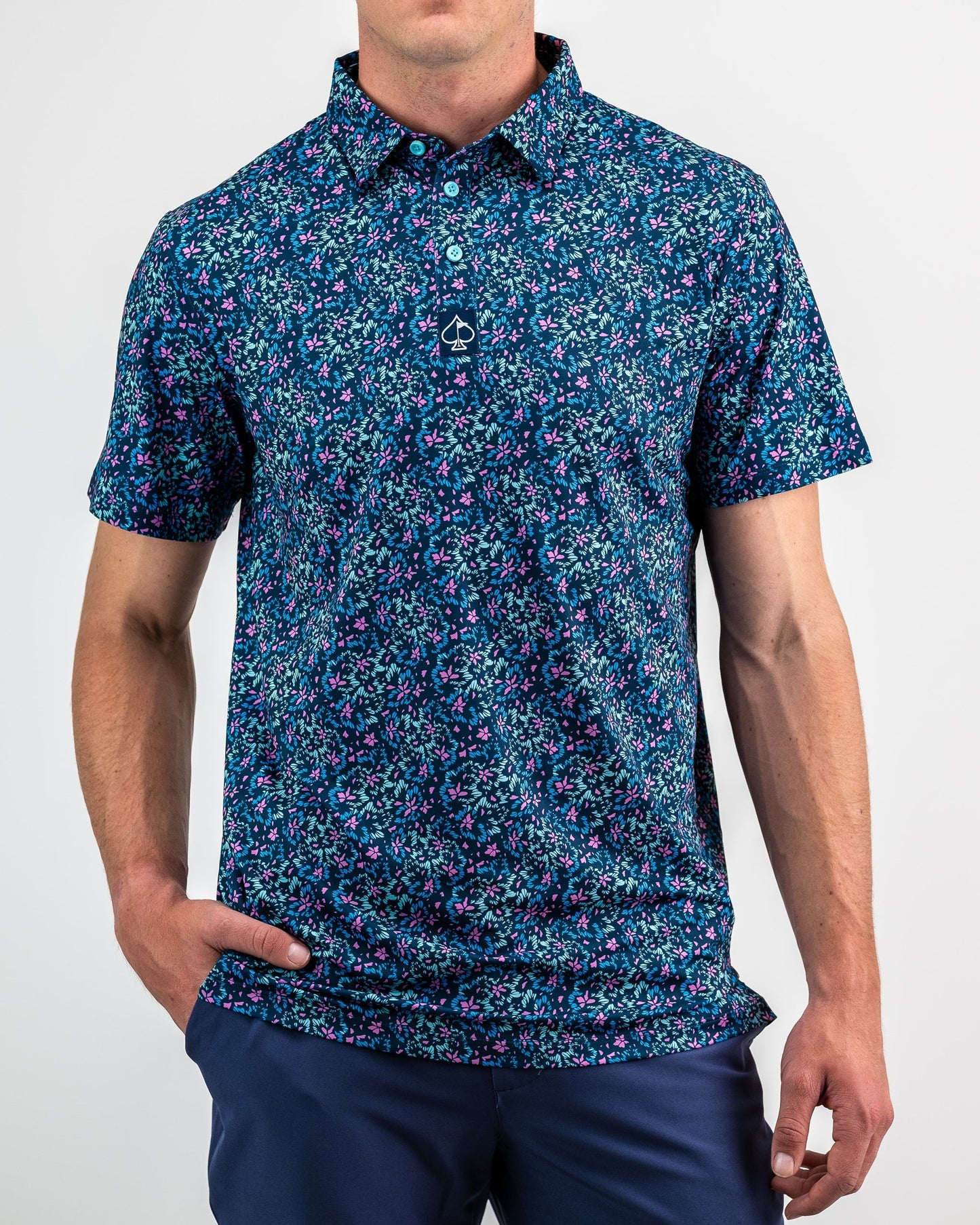 Brightly colored floral print fabric featuring vibrant fluorescent hues in a layered design. Ideal for spring fashion and vibrant decor.