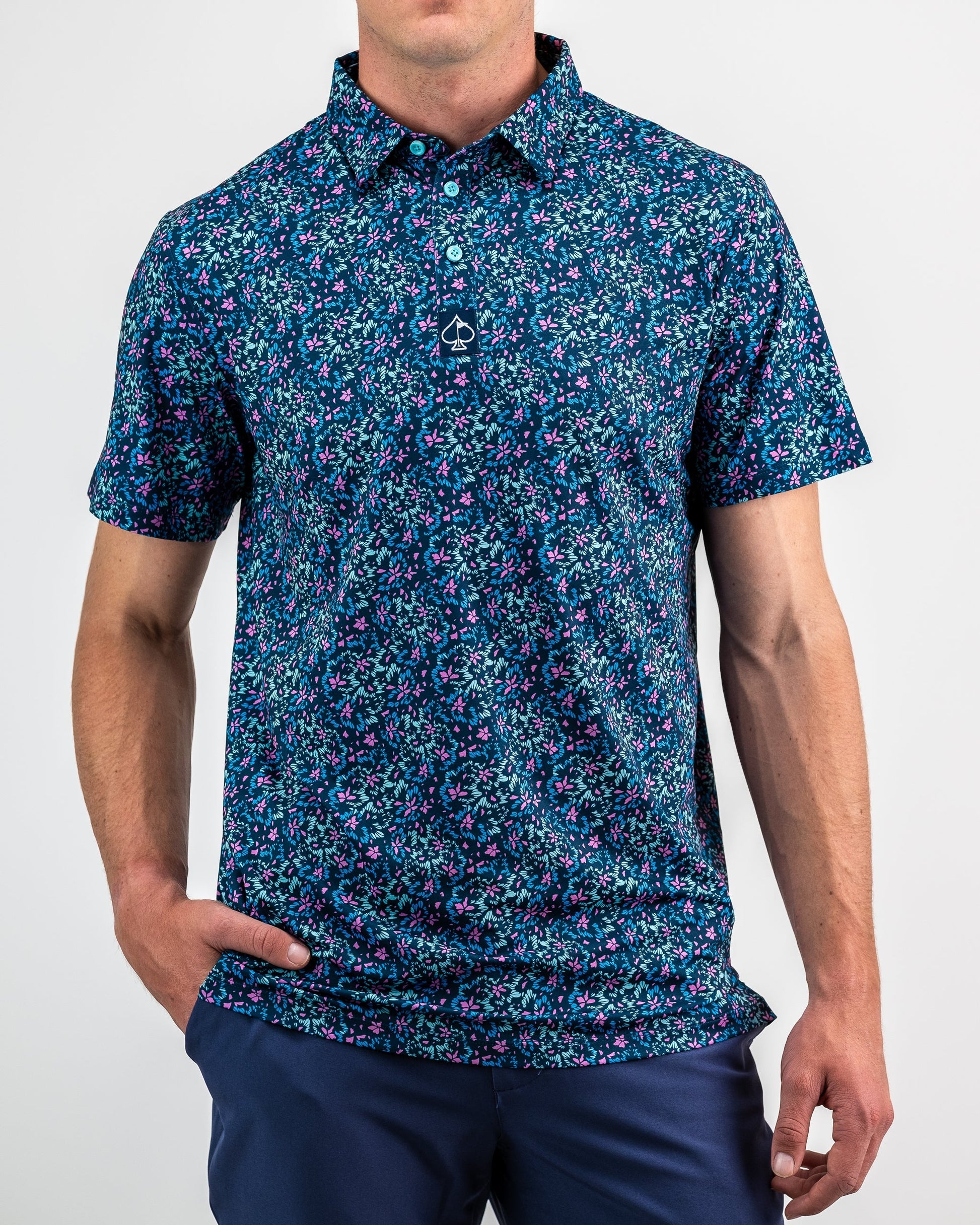 Brightly colored floral print fabric featuring vibrant fluorescent hues in a layered design. Ideal for spring fashion and vibrant decor.