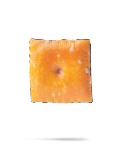 Cheese cracker ball marker featuring a realistic design, perfect for adding a fun touch to your golf game.
