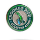 Crooked Dick CC Ball Marker featuring a melting smile design and shamrock pattern.