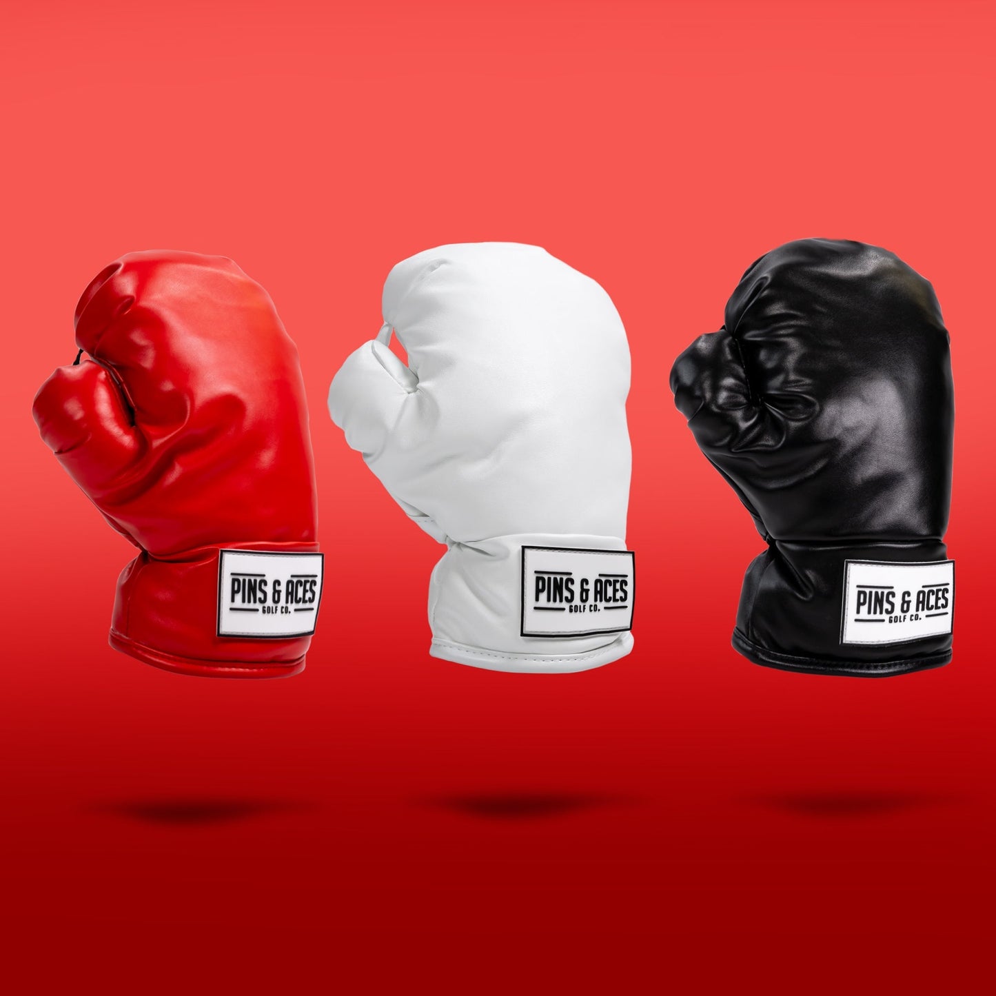 Red boxing glove driver cover for golf clubs, featuring a sleek design and gradient finish.