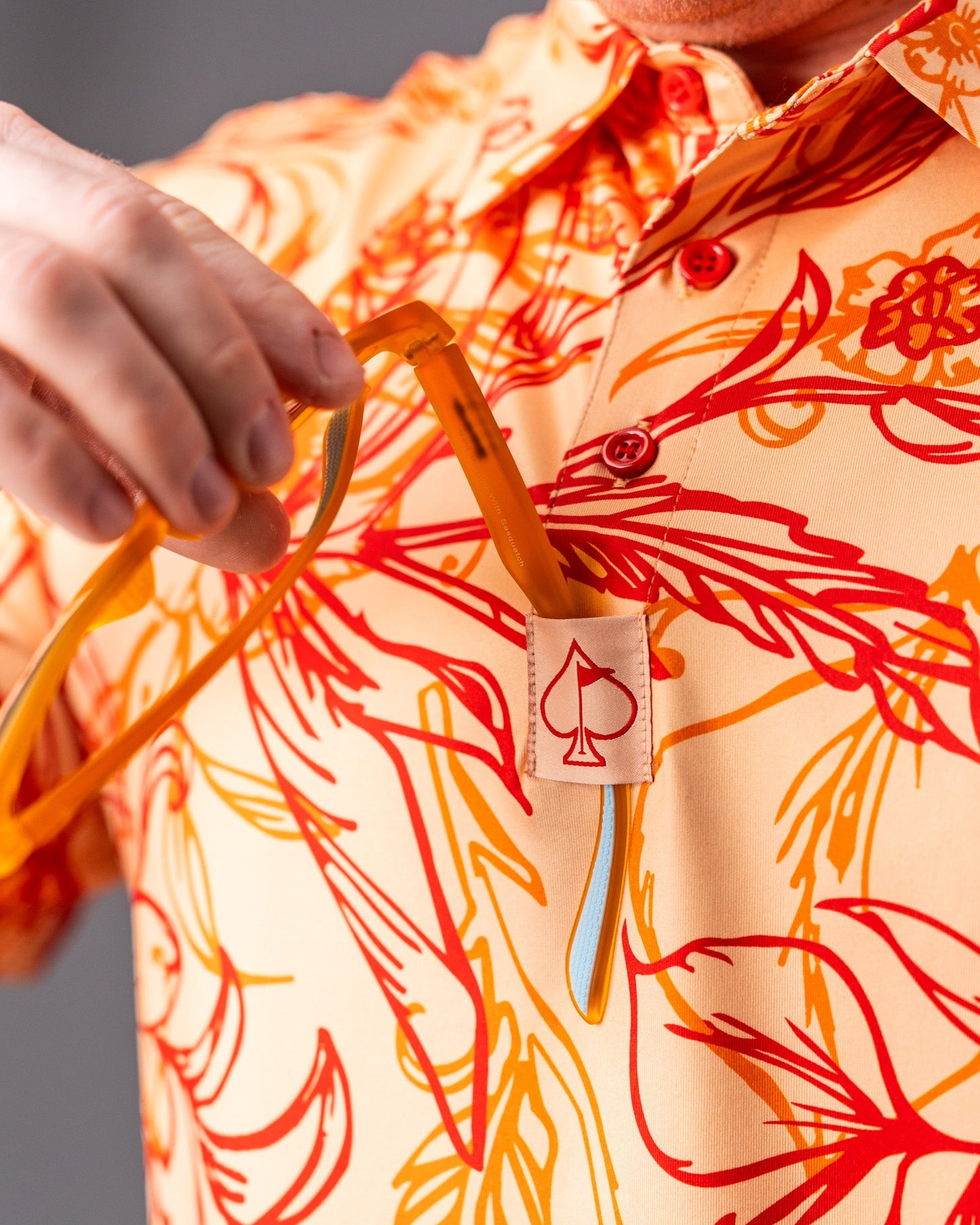 Cabo Sunburst polo shirt in vibrant yellow with a stylish design and short sleeves.