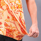 Cabo Sunburst polo shirt in vibrant orange with a modern design and subtle texture.