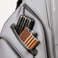 Player Preferred™ Cart Bag in Flat Ash color, featuring multiple zippered pockets and a comfortable shoulder strap, displayed against a neutral background.