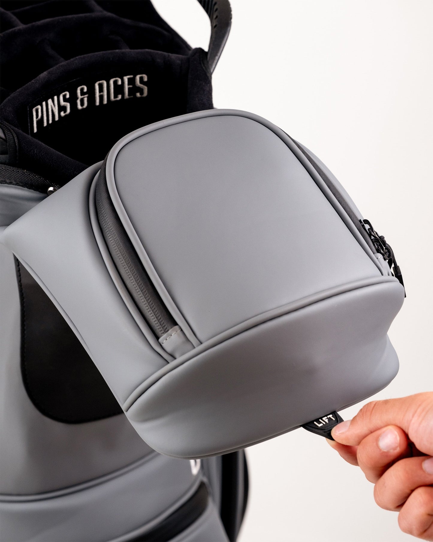 Player Preferred™ Cart Bag in Flat Ash color, featuring multiple pockets, a sleek design, and a comfortable carrying strap.