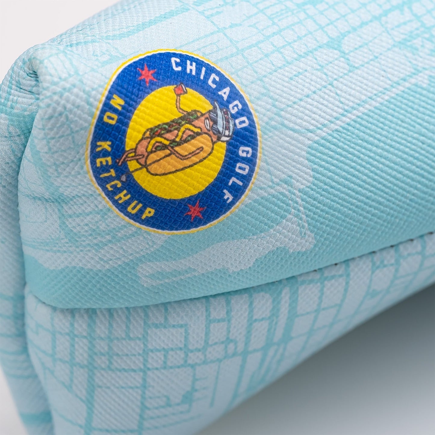 Chicago Dog blade putter cover featuring a circular logo design, showcasing a vibrant and unique style for golfers.