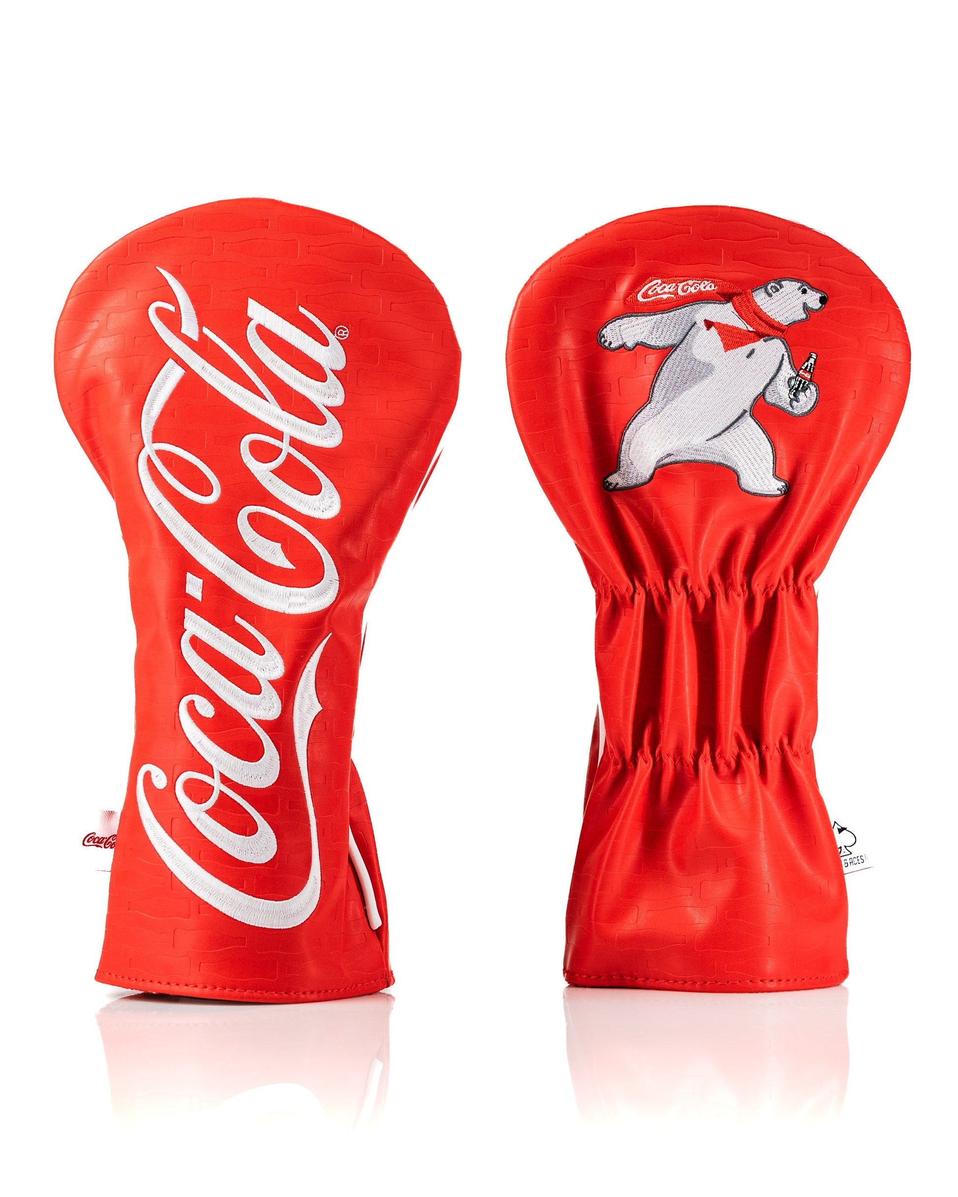 Bold Coca-Cola driver cover featuring iconic red color, logo, and playful polar bear design for stylish golf accessories.
