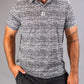 Men's Fragment Black golf polo featuring a bold, abstract pattern in black and white, perfect for stylish performance on the course.