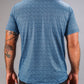 Men's blue golf shirt with a textured squiggle pattern, showcasing a relaxed fit and short sleeves from the back view.