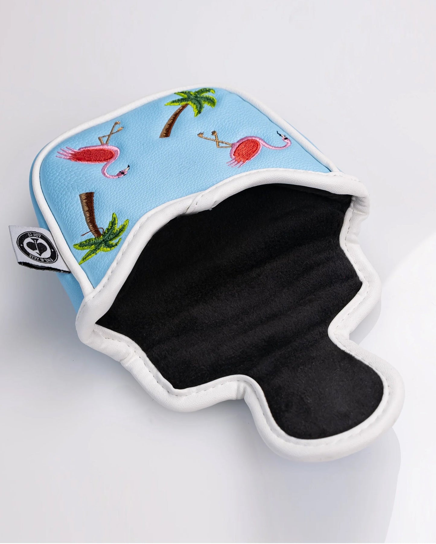 Dancing Flamingos mallet putter cover in an open position, featuring a vibrant pink flamingo design on a black background.