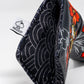 Koi Flow Blade Putter Cover featuring vibrant fire waves design on a black background.