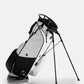 Alt text: Player Preferred™ Golf Bag in Domino design, featuring a sleek, modern look with multiple pockets and a comfortable strap, set against a neutral background.
