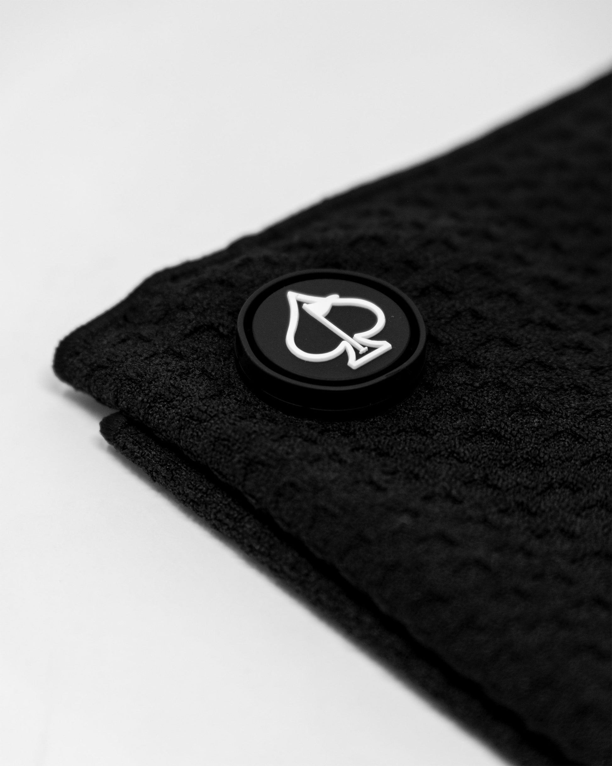 Magnetic towel in black color, showcasing its sleek design and magnetic feature for easy attachment and convenience.