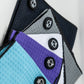 White magnetic towel with a sleek design, featuring a magnet on the corner for easy attachment and storage.