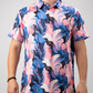 Bold golf polo featuring a melting floral pattern in vibrant pink, blue, and white hues, perfect for standing out on the course.