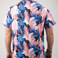 Men's short-sleeve golf shirt featuring a vibrant melting floral pattern in pink, blue, and white hues.