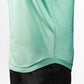 Close-up of a mint green Player Preferred™ Polo with spearmint stripes, paired with black pants.