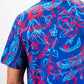 Cabo Colada retro-style polo shirt featuring a vibrant design with tropical motifs and a relaxed fit.