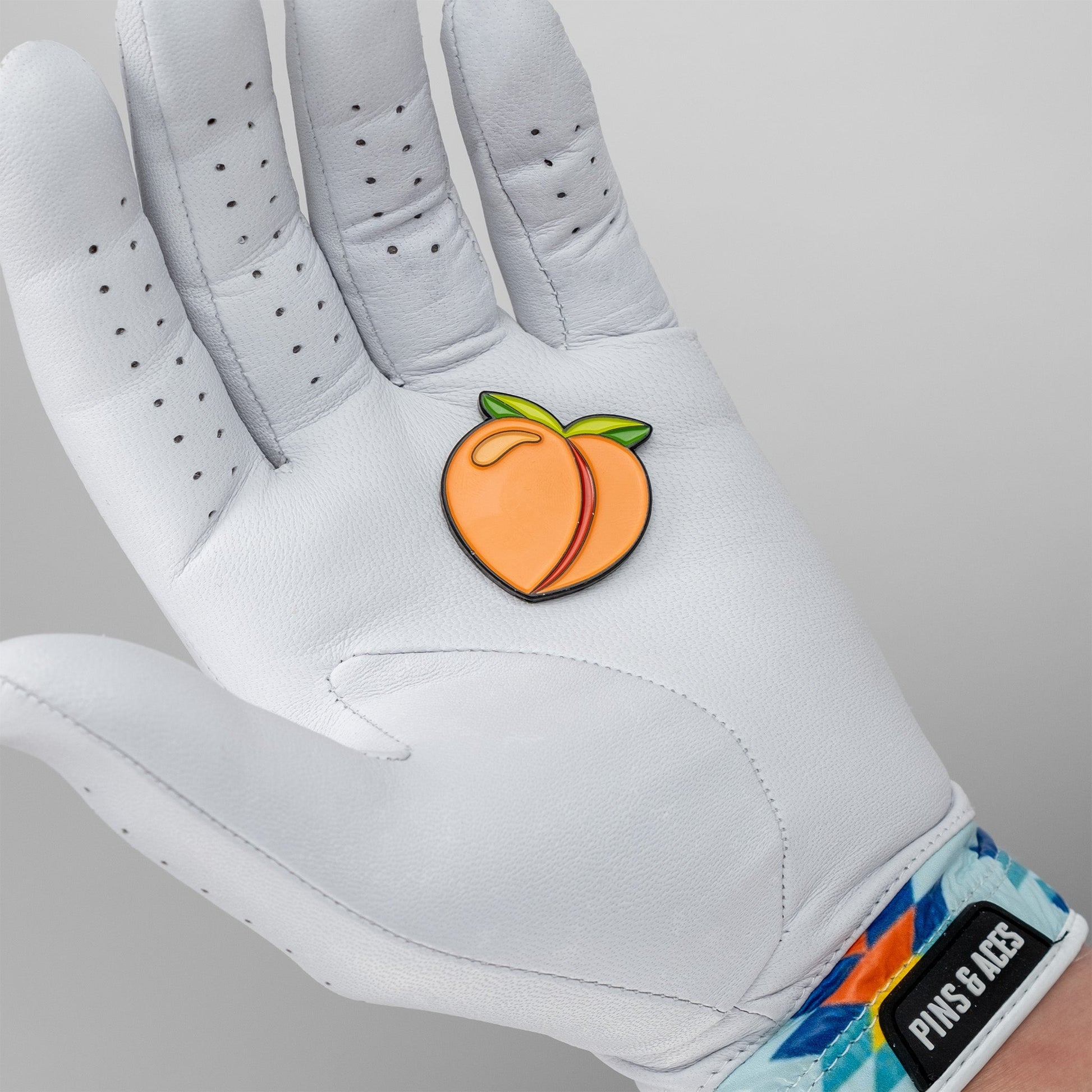 Peach Ball Marker for golf with a vibrant peach design, ideal for marking ball positions on the green.
