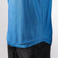 Close-up of a blue Player Preferred™ Polo shirt with a cosmic swirl pattern, paired with black pants.
