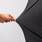 Close-up of a hand stretching the black and gray patterned Player Preferred™ Polo - Night Wave fabric.