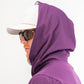 Performance golf hoodie in houndstooth raspberry, featuring a sleek design and a comfortable fit for stylish golfers.