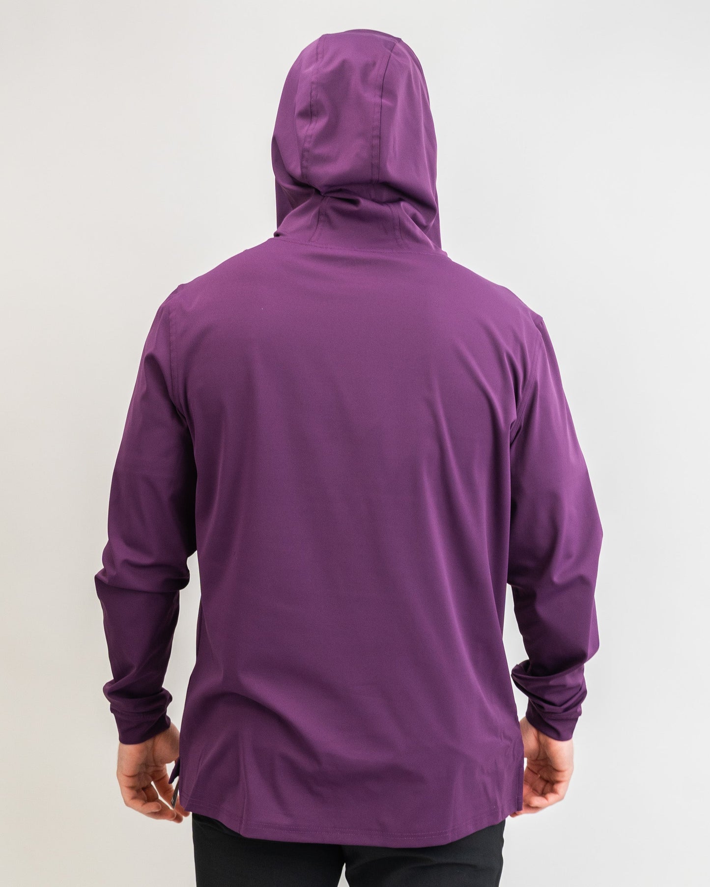 Men's performance golf hoodie in houndstooth raspberry, featuring a stylish hood and a sleek, athletic fit.