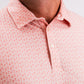 Coral polo shirt featuring a subtle palm tree pattern, designed for stylish golfers seeking comfort on the course.