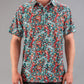 Bold teal golf shirt featuring a vibrant tiger and floral pattern, designed for golfers who want to stand out on the course.