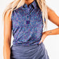 Women's Lavender Flower Power golf polo featuring a vibrant floral pattern, perfect for stylish performance on the course.