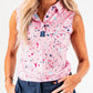 Women's pink sleeveless polo shirt featuring a vibrant splatter design, perfect for stylish golf outings.