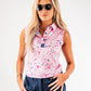 Women's pink splatter golf polo featuring a stylish collar and sleeveless design, perfect for a bold look on the course.