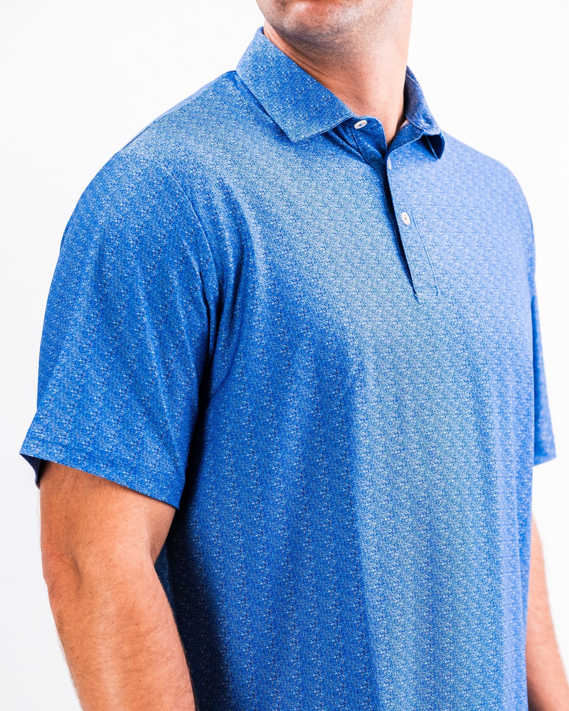 Player Preferred™ Polo in Cosmic Swirl design, featuring vibrant multicolor swirls on a breathable fabric, ideal for active wear.