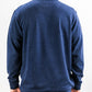 Back view of a person wearing a Heathered Navy Player Preferred™ Pullover with a collar and subtle embroidered logo on the upper back.