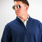 Man wearing a navy Heathered Player Preferred™ Pullover with sunglasses, looking to the side against a plain background.