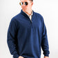Man wearing a navy heathered Player Preferred™ Pullover with a quarter-zip collar, standing against a white background.