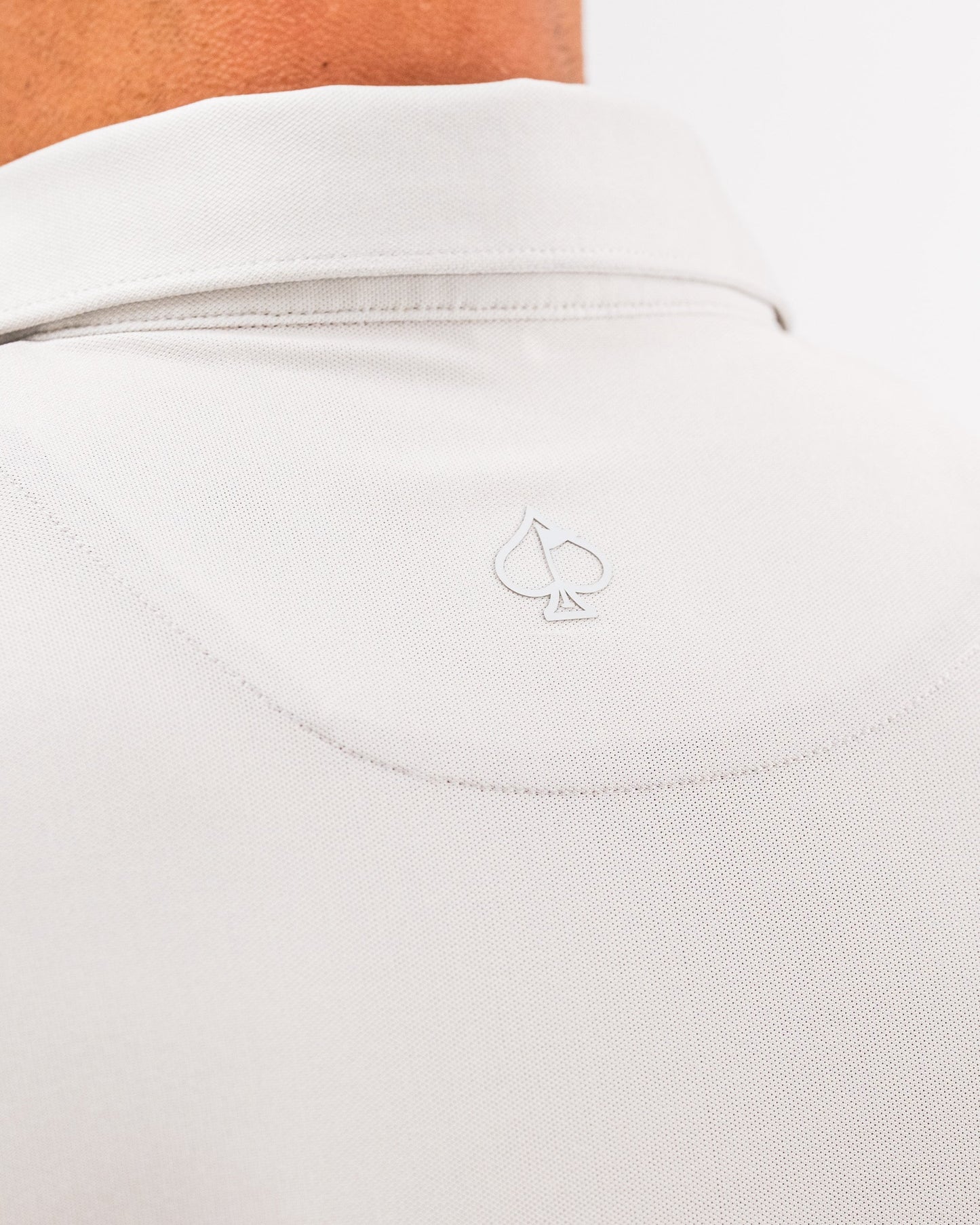 Player Preferred™ Polo in Spade Fade Light featuring a gradient design, short sleeves, and a classic collar, displayed on a white background.