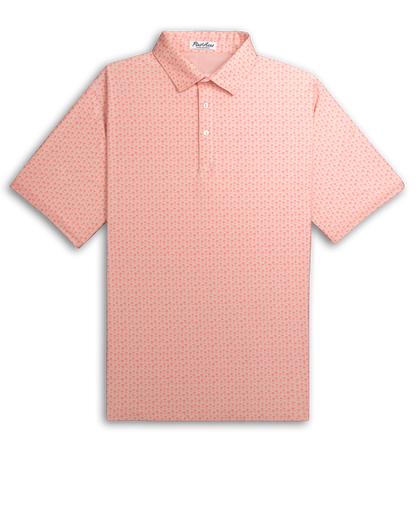 Player Preferred™ Polo in Coral Palms design featuring a vibrant coral color with palm leaf patterns on a smooth fabric background.