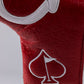 Close-up of a bold red golf club headcover with embossed spade pattern and white embroidered spade logo.
