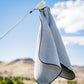 White magnetic towel with a sleek design, featuring a built-in magnet for easy attachment and convenience.