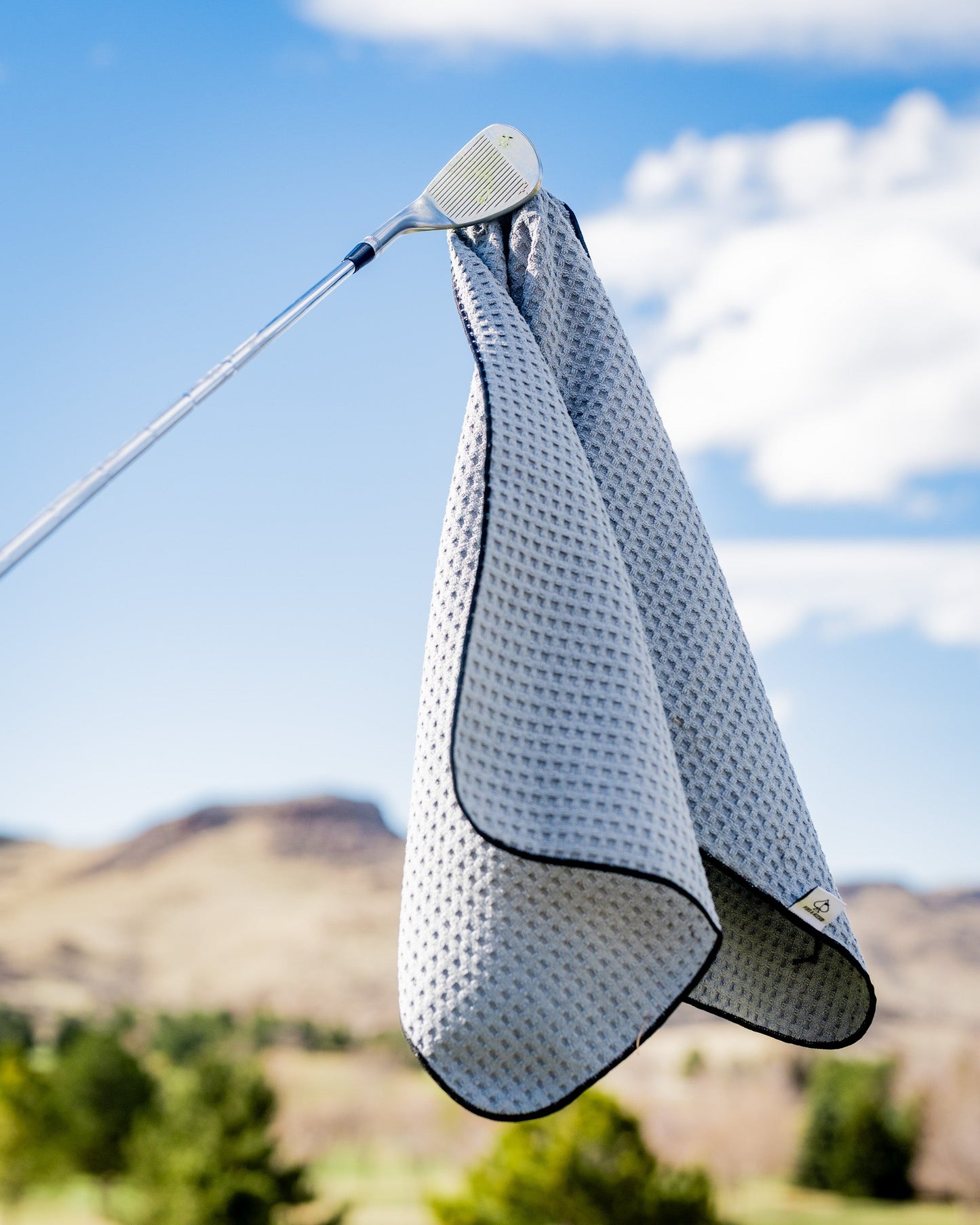 White magnetic towel with a sleek design, featuring a built-in magnet for easy attachment and convenience.