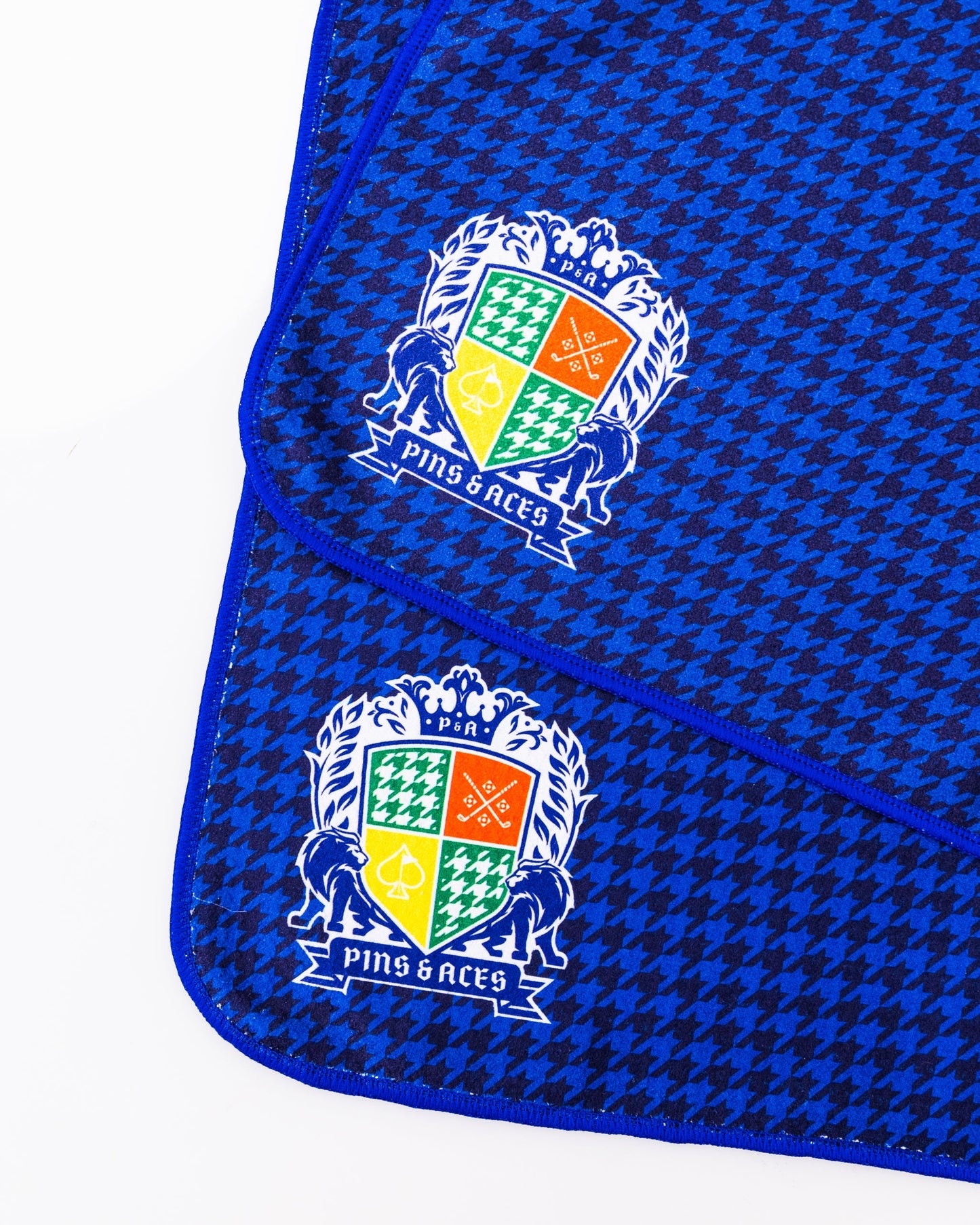 Royal Houndstooth Towel featuring a classic black and white houndstooth pattern on soft, absorbent fabric.