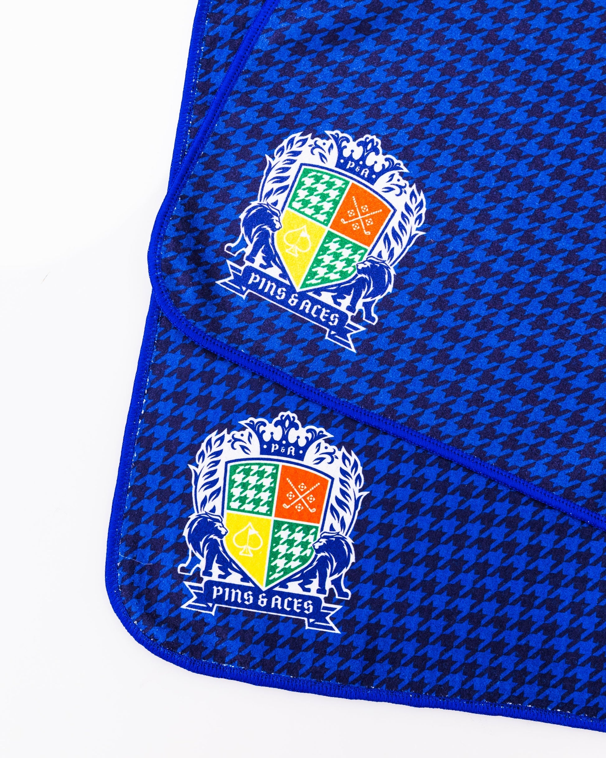 Royal Houndstooth Towel featuring a classic black and white houndstooth pattern on soft, absorbent fabric.