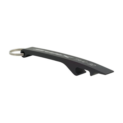 Outil de déverrouillage pour dragonnes TCS